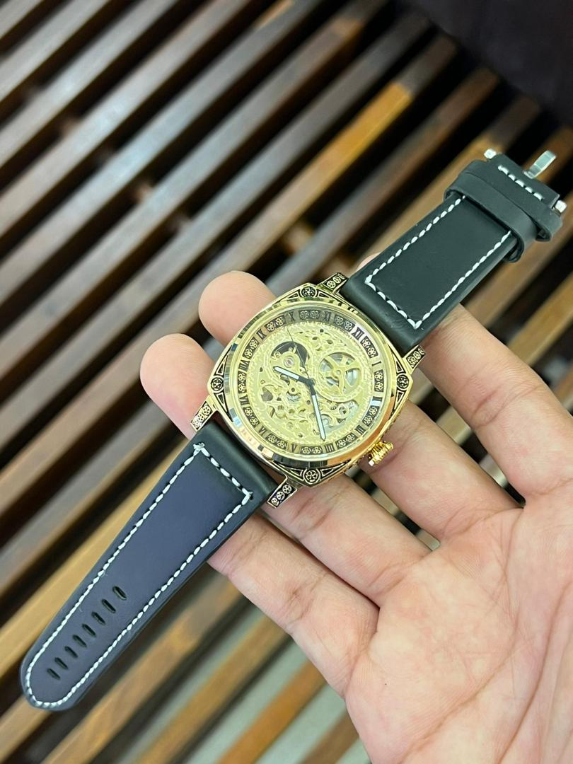 Skeleton Watch - Gold Held in Hand